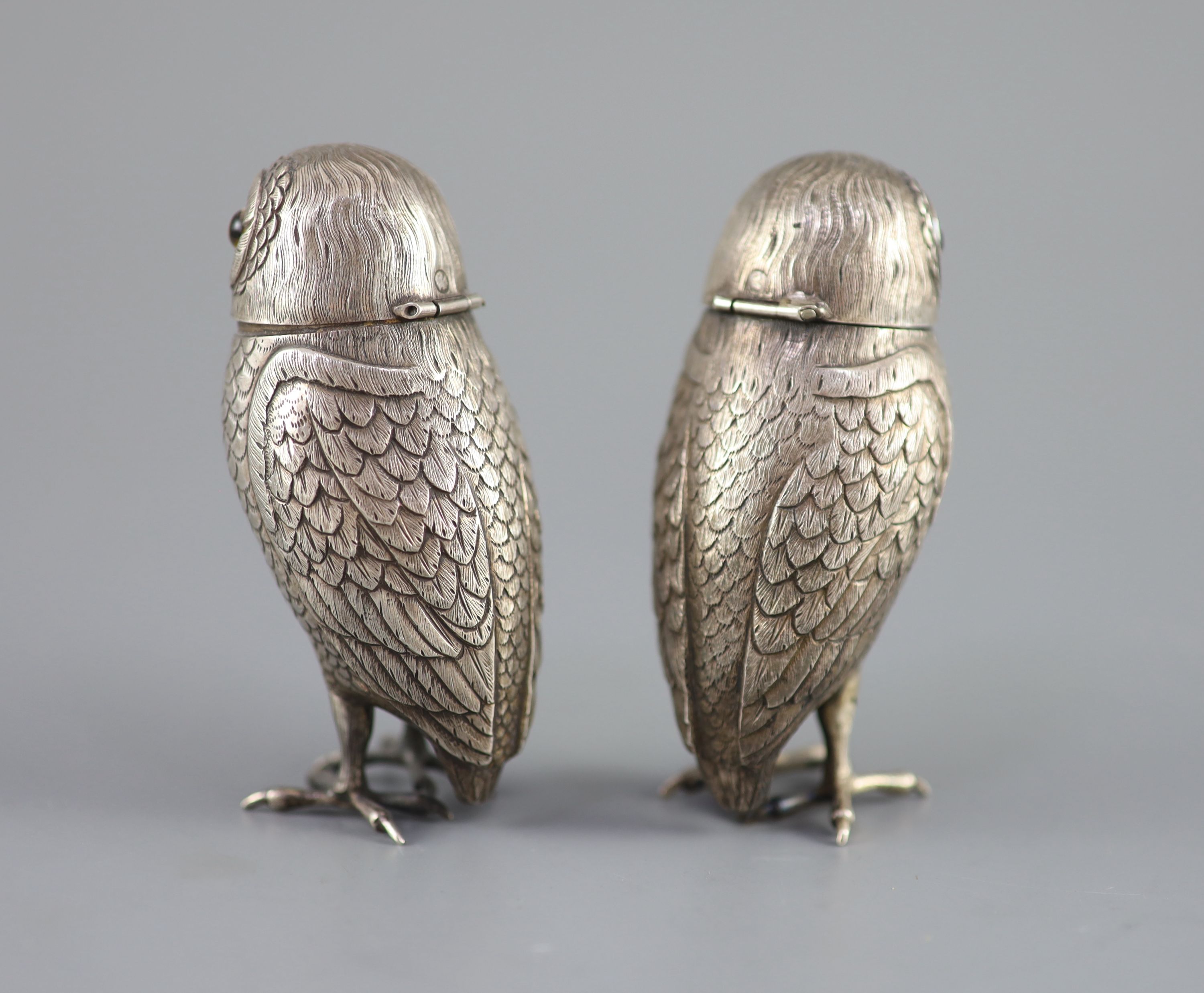 A pair of late 19th/early 20th century Dutch silver novelty pepperettes, modelled as owls